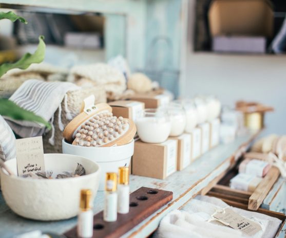 pexels-photo-5490778-5490778 Many fragrant candles placed near massage brushes and perfume in shop for sale